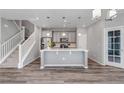 Modern kitchen with stainless steel appliances, white countertops, and stylish pendant lighting at 3429 Hardin St, Castle Rock, CO 80109
