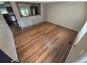 Open concept living room features beautiful hardwood flooring and an open railing at 3735 S Lewiston St, Aurora, CO 80013