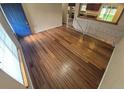 This living room has gorgeous wood floors, an open railing, and plenty of natural light at 3735 S Lewiston St, Aurora, CO 80013