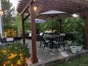 Cozy backyard patio with a pergola, outdoor furniture, and lush landscaping at 3183 W 114Th Loop, Westminster, CO 80031