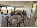 Bright and airy living room with floor-to-ceiling windows showcasing city views and modern furnishings at 100 Park Ave # 1405, Denver, CO 80205