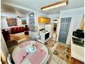 Open kitchen features eat in dining area and laminate flooring at 5567 E Asbury Ave, Denver, CO 80222