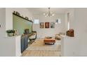 Bright home office with custom built-ins, stylish decor, and ample natural light at 6619 Mariposa Ct, Denver, CO 80221