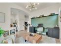 Spacious living room with stylish decor, built-in shelving, and modern furnishings at 6619 Mariposa Ct, Denver, CO 80221