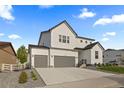 Charming modern farmhouse with a three-car garage and manicured landscaping at 4739 Gray Wolf Ln, Castle Rock, CO 80104
