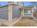 Home featuring a side entry with a charming porch and a well-kept lawn at 22162 E Alamo Ln, Centennial, CO 80015