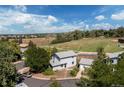 Charming two-story home with detached garage and view of the green space from the aerial view at 6502 W 96Th Ave, Westminster, CO 80021