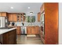 Well-equipped kitchen features stainless steel appliances, granite countertops, and ample cabinet space at 6502 W 96Th Ave, Westminster, CO 80021