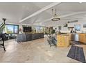 Spacious living room and kitchen area with modern appliances, tiled floors, and scenic outdoor views at 197 Sawmill Ln, Idaho Springs, CO 80452