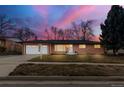 Charming single-story home boasting a brick facade, attached garage, and well-manicured lawn at 3565 S Holly St, Denver, CO 80237