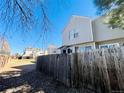 Fenced backyard with privacy fence and well maintained lawn at 4111 E 94Th Ave # E, Thornton, CO 80229
