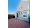 Backyard patio with sliding glass door access to the home at 4111 E 94Th Ave # E, Thornton, CO 80229