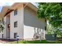 Side view of building exterior with siding, windows, and lawn at 2201 Sable Blvd # 1003, Aurora, CO 80011