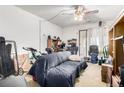 View of cluttered living room with couch and natural light at 2201 Sable Blvd # 1003, Aurora, CO 80011