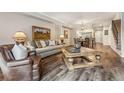 Inviting living room with hardwood floors, a comfortable sofa, and stylish decor throughout at 7250 Eastmoor Dr # 119, Denver, CO 80237