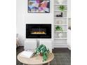 Close-up of the living room fireplace and shelving, styled with neutral vases and plants at 3635 Osage St, Denver, CO 80211