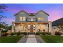 Inviting two-story home boasting a covered front porch and well-manicured lawn at 3256 S Corona, Englewood, CO 80113