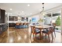 Bright dining area seamlessly flows into a modern kitchen with stainless steel appliances at 13960 Box Turtle Loop, Parker, CO 80134