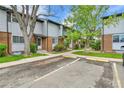 View of the townhome exterior with parking, showcasing neat landscaping and well-maintained building facades at 3061 W 92Nd Ave # 8B, Westminster, CO 80031