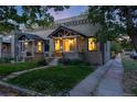 Stone duplex with large front yard showcasing the property's character and neighborhood charm at 194 S Emerson St, Denver, CO 80209