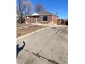 Cozy brick home with an expansive concrete driveway perfect for multiple vehicles and/or recreational vehicles at 10866 Pearl St, Northglenn, CO 80233