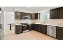 Modern kitchen featuring sleek countertops, stainless steel appliances, and custom cabinetry with ample counter space at 10703 Jordan Ct, Parker, CO 80134
