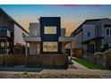 Contemporary home boasts modern design with clean lines, complemented by a neat front yard with a charming fence at 3632 Lipan St, Denver, CO 80211