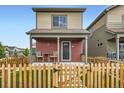 Attractive two-story home with a charming fenced front yard at 1199 Hummingbird Cir, Longmont, CO 80501