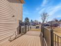 Spacious wooden deck offers a relaxing outdoor space with views of the neighborhood at 11535 Albion Ct, Thornton, CO 80233