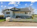 Beautiful home with a welcoming porch and a classic white picket fence at 371 Buckskin Ct, Parker, CO 80138