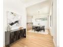 Contemporary dining area featuring modern lighting, a sleek table setting, and access to a stylish kitchen at 4398 N Pecos St, Denver, CO 80211