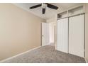 Neutral bedroom with ceiling fan, closet and carpet flooring at 17949 E Ohio Cir, Aurora, CO 80017