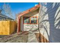 Side view of a home with a brick path leading to the front door at 17949 E Ohio Cir, Aurora, CO 80017
