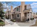 Attractive two-story townhome with brick accents, covered porches, and mature landscaping at 804 Summer Dr, Highlands Ranch, CO 80126