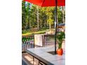 Outdoor deck with forest views, perfect for enjoying nature and relaxing in a peaceful environment at 200 The Lane Rd, Golden, CO 80403