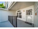 Welcoming entryway with decorative glass door, side window, and a cheerful 'Home' doormat at 1697 S Cole St # B5, Lakewood, CO 80228