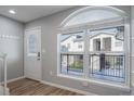 Inviting entryway with modern decor, a large window with natural light, and coat rack at 1697 S Cole St # B5, Lakewood, CO 80228