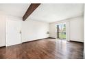 Living room with hardwood floors and a sliding glass door to a balcony at 16359 W 10Th Ave # Yy3, Golden, CO 80401
