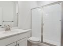 Clean, bright bathroom with a glass-enclosed shower at 8229 Butte Creek St, Littleton, CO 80125