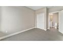 Neutral bedroom with carpet, closet, and en-suite bathroom, ideal for comfortable living and privacy at 2323 Lakeshore Ln # 11, Superior, CO 80027