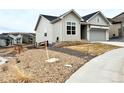 This home features a 2 car garage, siding, and well-maintained landscaping at 295 Kitselman Dr, Castle Rock, CO 80104