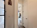 Bright hallway featuring hardwood floors and neutral color palette leading into the living room at 295 Kitselman Dr, Castle Rock, CO 80104