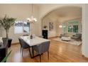 Elegant dining room showcasing an open floor plan, modern chandelier, and contemporary decor at 14910 Williams St, Thornton, CO 80602