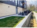 Cozy outdoor patio with adirondack chairs and green grass at 2718 Pine St # 305, Boulder, CO 80302