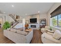 Spacious living room featuring a fireplace and hardwood floors at 22537 E Swallow Pl, Aurora, CO 80016