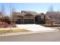 Charming single-Gathering home with a driveway, attractive landscaping, and a welcoming front entrance at 3212 S Kirk Way, Aurora, CO 80013