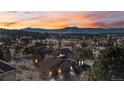 House in a community with mountain views at sunset at 1535 Plowman Dr, Monument, CO 80132