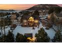 House with backyard and mountain views at sunset at 1535 Plowman Dr, Monument, CO 80132