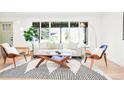 Inviting living room with a large bright window, modern furniture, and neutral colors at 4320 Lamar St, Wheat Ridge, CO 80033