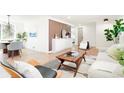 Bright living room featuring modern decor, sleek furniture, and open layout at 4320 Lamar St, Wheat Ridge, CO 80033